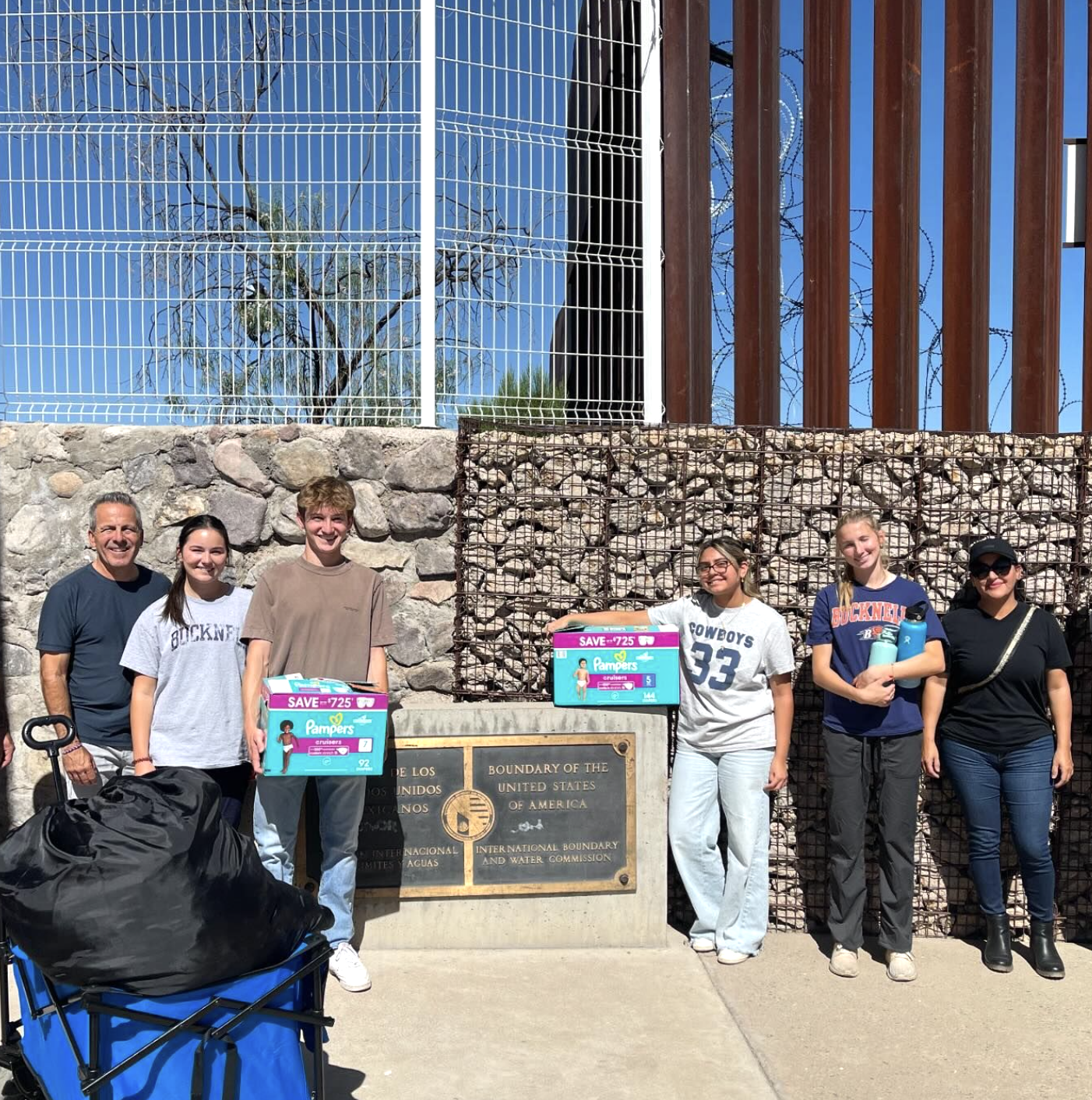 Miles and fellow volunteers with donated supplies at the border in Nogales